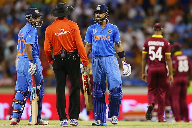 Virat Kohli questions umpire Kumar Dharmasena after being given caught by Marlon Samuels, March 6, 2015. Photograph: Paul Kane/Getty Images