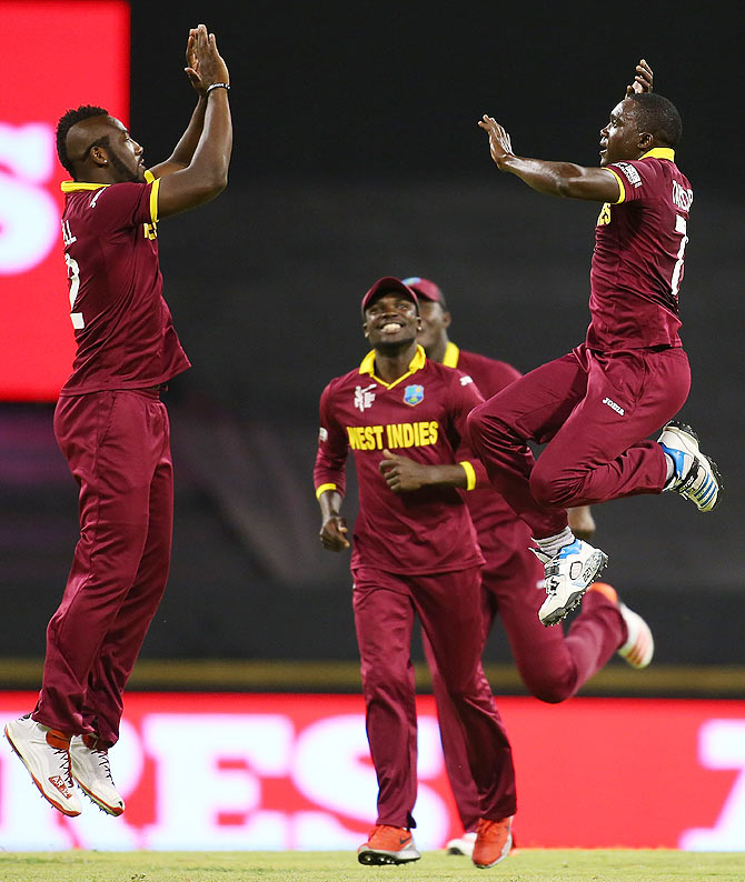 Andre Russell and Jerome Taylor exult after Rohit Sharma's wicket, The World Cup, WACA, March 6, 2015.