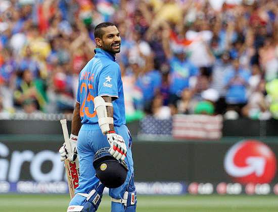 Indian player Shikhar Dhawan celebrates after scoring a century against  South Africa at the Melbourne Cricket Stadium
