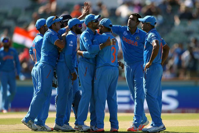 India's players celebrate a wicket