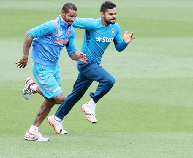 Virat Kohli,right, with Shikhar Dhawan