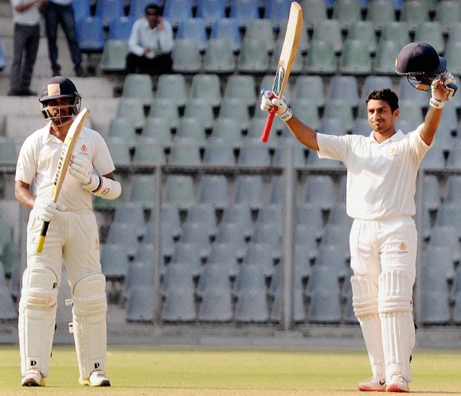 K L Rahul applauds after Karun Nair gets to a hundred during their partnership in the Ranji Trophy final against Tamil Nadu