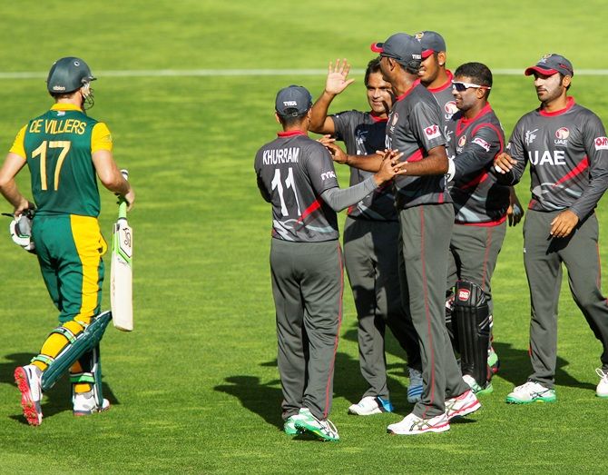 United Arab Emirates players celebrate the wicket of AB de Villiers
