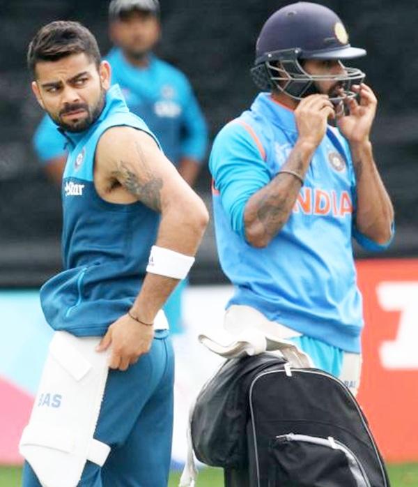 Virat Kohli, left, and Shikhar Dhawan 