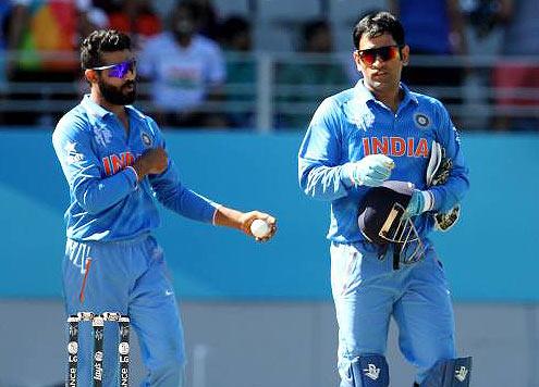 Indian player Ravindra Jadeja speaks with captain Mahendra Singh Dhoni 