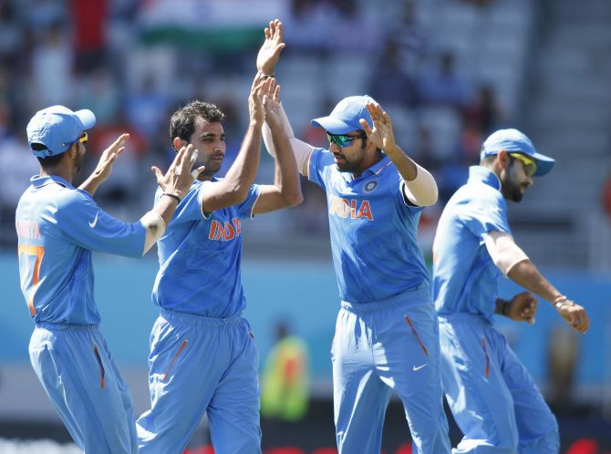 Mohammed Shami celebrates after dismissing Chamu Chibhabha. Photograph: Nigel Marple/Reuters