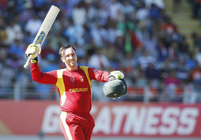 Zimbabwe's Brendan Taylor celebrates scoring a century against India during their World Cup match at Eden Park in Auckland on Saturday
