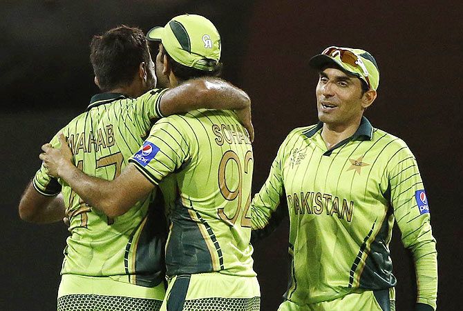 Pakistan's captain Misbah-ul-Haq (right) celebrates with teammates Sohaib Maqsood (centre) and Wahab Riaz