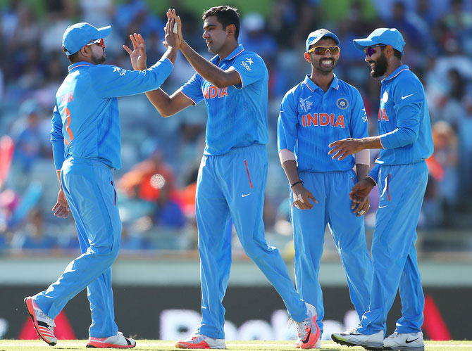 Ravichandran Ashwin of India celebrates the wicket of Mohammad Naveed of the UAE at the WACA