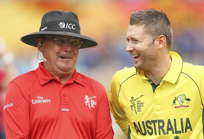 Umpire Ian Gould and Michael Clarke of Australia