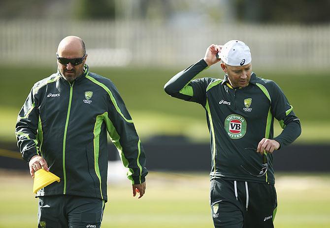 Michael Clarke of Australia speaks with Team Physiotherapist Alex Kountouris, Australian , during a nets session