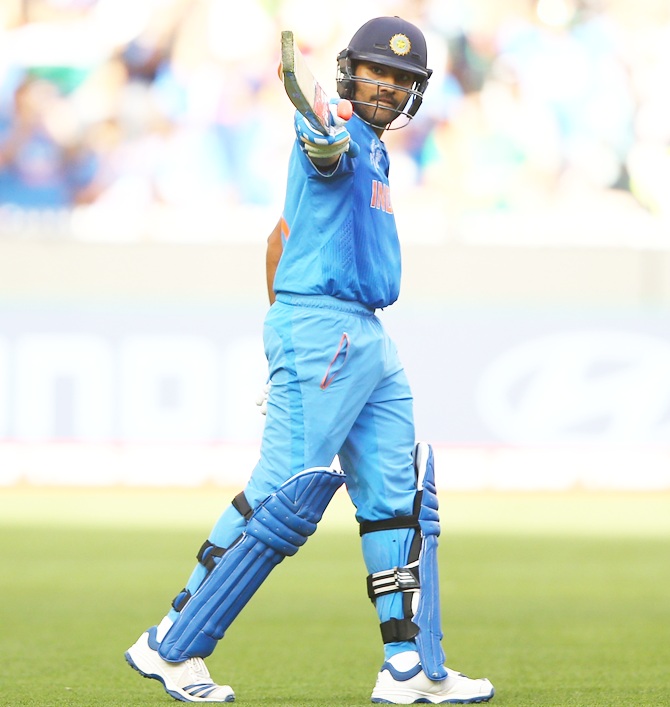Rohit Sharma celebrates his century against Bangladesh at the Melbourne Cricket Ground, March 19, 2015. Photograph: Robert Cianflone/Getty Images.