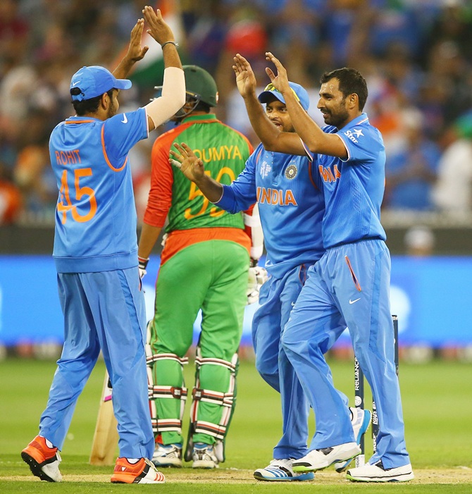 Mohammed Shami and his team-mates celebrate Bangladesh star Mohammad Mahmudullah's wicket. Photograph: Robert Cianflone/Getty Images