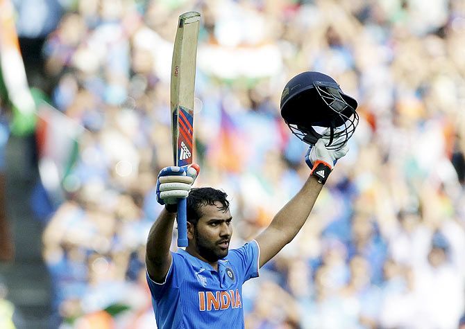 India's batsman Rohit Sharma celebrates reaching his century against Bangladesh in Melbourne on Thursday