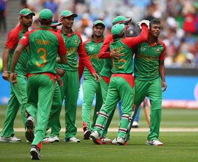 Rubel Hossain is congratulated by his Bangladesh teammates after dismissing Virat Kohli