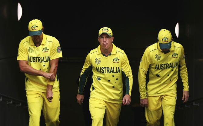 Australia's David Warner walks out on to the field