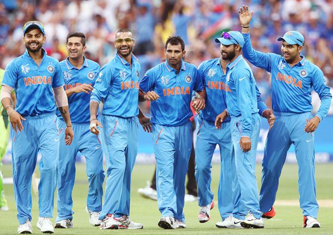 Mohammed Shami of India is congratulated by teammates after getting a wicket