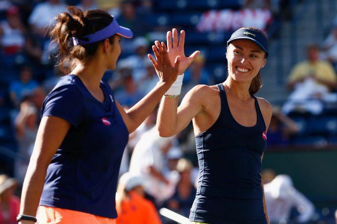 Sania Mirza, left, and her Swiss partner Martina Hingis