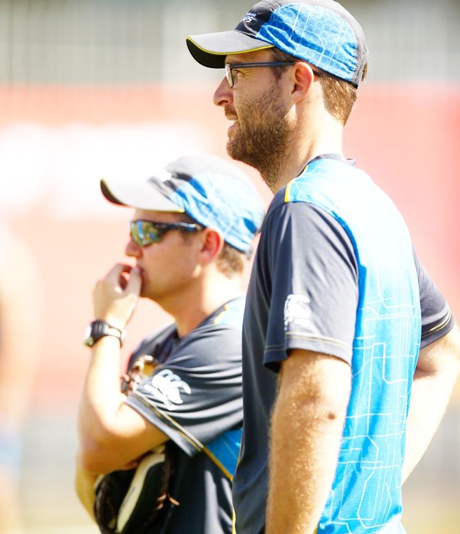Daniel Vettori, right, chats with New Zealand coach Mike Hesson