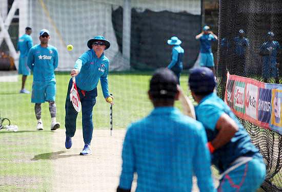 Indian coach Duncan Fletcher gives tennis ball practice to Suresh Raina during a nets session at the Sydney Cricket Ground  on Monday