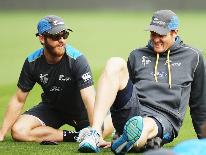 Kane Williamson of New Zealand and Martin Guptill of New Zealand stretch