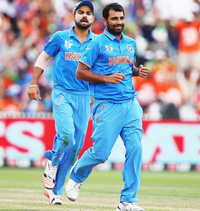 Mohammed Shami of India celebrates with Virat Kohli