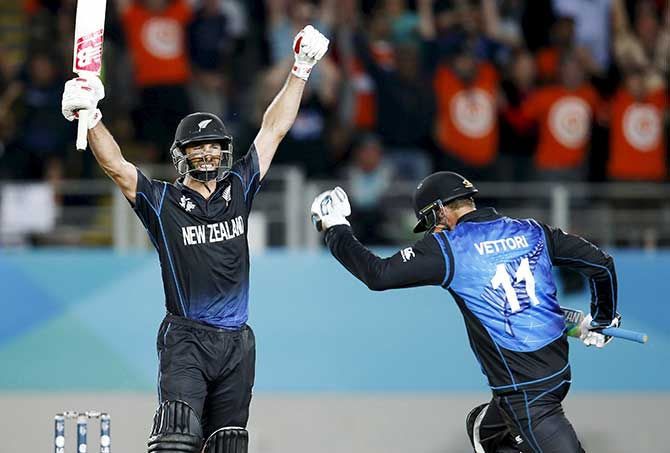 New Zealand's Grant Elliot (left) reacts after hitting the winning runs alongside as teammate Daniel Vettori celebrates