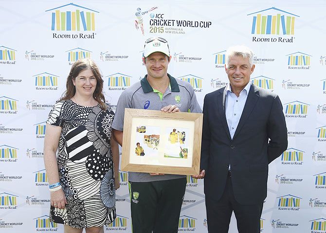 Chantal Lewis, Director Room to Read Australia, Shane Watson of Australia and Dave Richardson, CEO of ICC pose during a book launch at the Sydney Cricket Ground on Wednesday