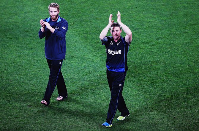 New Zealand's Kane Williamson (left) and captain Brendon McCullum thank the crowd after winning their World Cup semi-final against South Africa at Eden Park on Tuesday