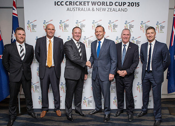 New Zealand and Australia Prime Ministers John Key (centre,left) and Tony Abbott (centre, right), greet each other as New zealand captain Brendon McCullum (extreme left), former Kiwi captain Martin Crowe (2nd from left), former Australia captain Allan Border (2nd from right) and Australia skipper Michael Clarke