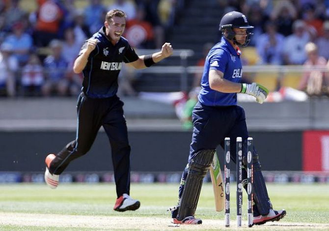 New Zealand's Tim Southee (left) celebrates bowling out England's Ian Bell during their World Cup Pool match at Wellington