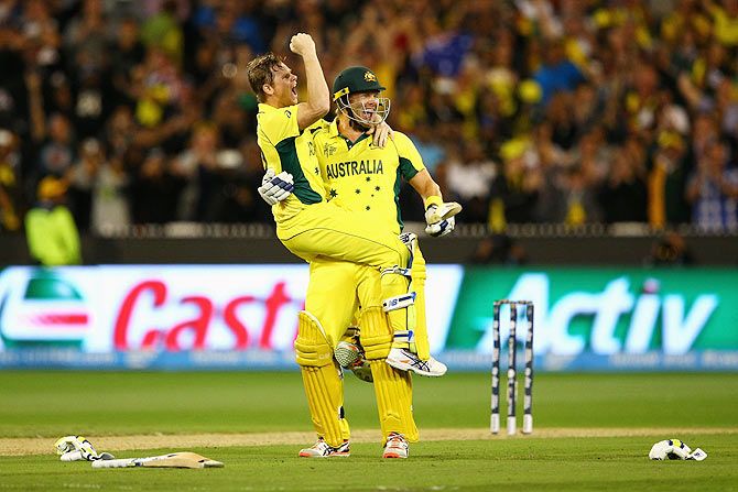 Australia's Steve Smith and teammate Shane Watson celebrate winning the 2015 ICC Cricket World Cup final on Sunday