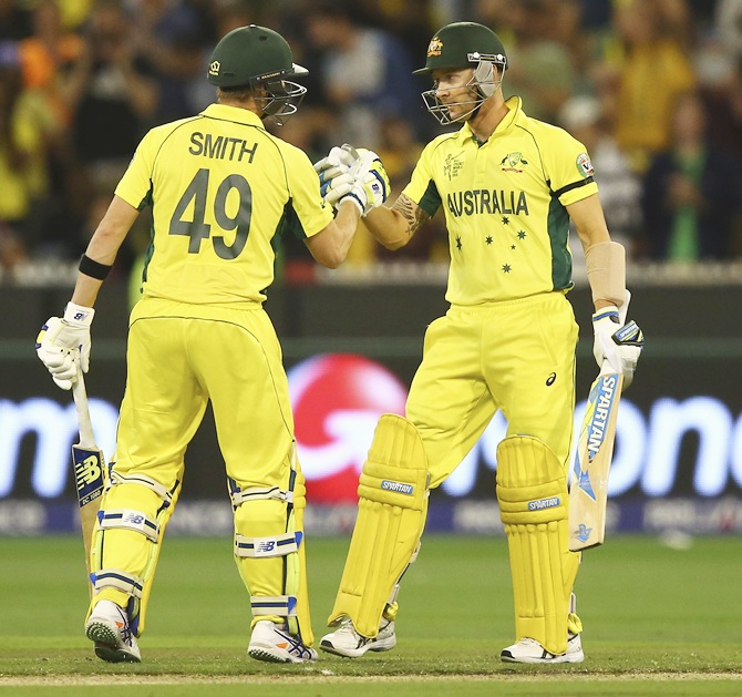 Steve Smith congratulates Michael Clarke after the skipper scored his half century. Photograph: Ryan Pierse/Getty Images