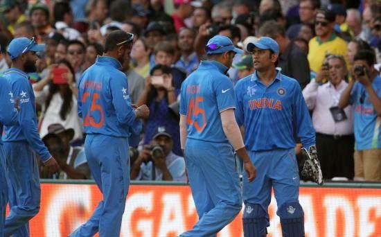 Mahendra Singh Dhoni walks back to the pavilion at the end of Australia's innings in the World Cup semi-final at the SCG