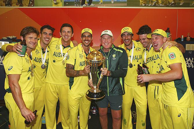 Australia's Shane Watson, Pat Cummins, Josh Hazlewood, Mitchell Johnson, bowling coach Craig McDermott, Mitchell Starc, Mitch Marsh and James Faulkner pose after the 2015 ICC Cricket World Cup final at Melbourne Cricket Ground on Sunday