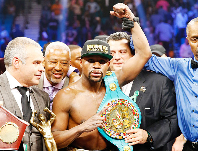 Floyd Mayweather Jr. celebrates the unanimous decision victory after defeating Manny Pacquiao during the welterweight unification championship bout at MGM Grand Garden Arena in Las Vegas, Nevada, on Saturday