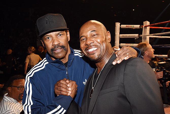 Actor Denzel Washington (left) with director Antoine Fuqua pose ringside