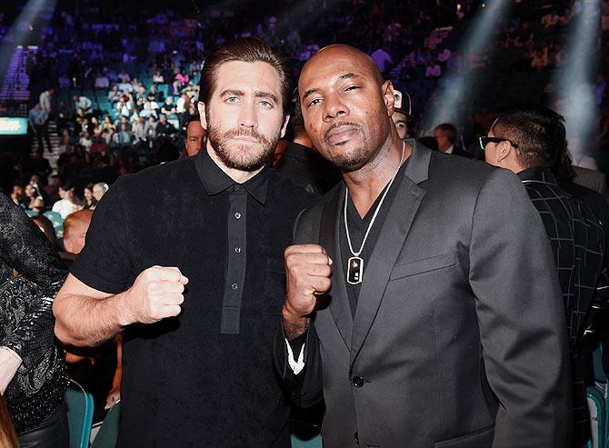 Actor Jake Gyllenhaal (left) and director Antoine Fuqua pose ringside