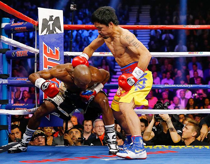 Manny Pacquiao throws a right at Floyd Mayweather Jr.