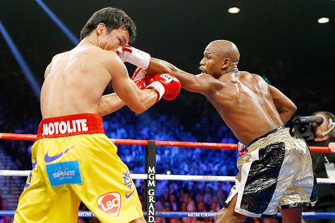 Floyd Mayweather Jr. throws a left at Manny Pacquiao