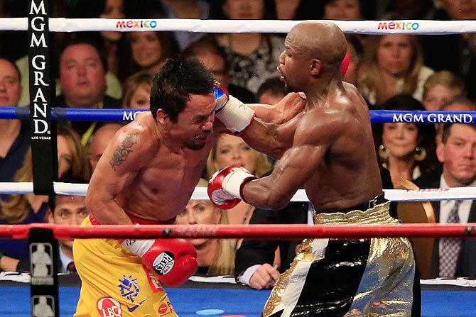 Floyd Mayweather Jr. throws a right at Manny Pacquiao 