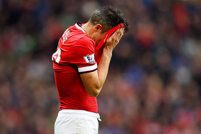 Manchester United's Robin van Persie reacts after missing a penalty