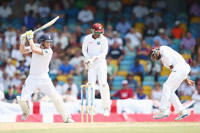  Ben Stokes of England plays through the offside as wicketkeeper West Indies' Denesh Ramdin and Shai Hope watch on Day 3