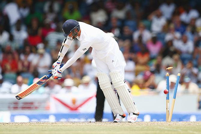 England's Stuart Broad is bowled by West Indies' Jason Holder