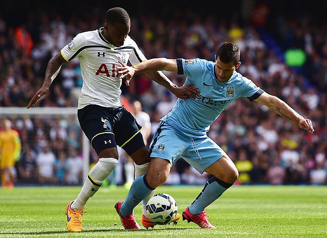 Danny Rose of Tottenham Hotspur tackles Sergio Aguero of Manchester City