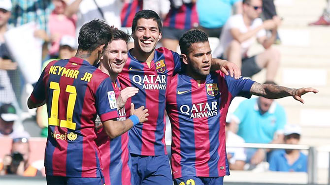 FC Barcelona's Lionel Messi, Luis Suarez and Dani Alves celebrate with Neymar after a goal