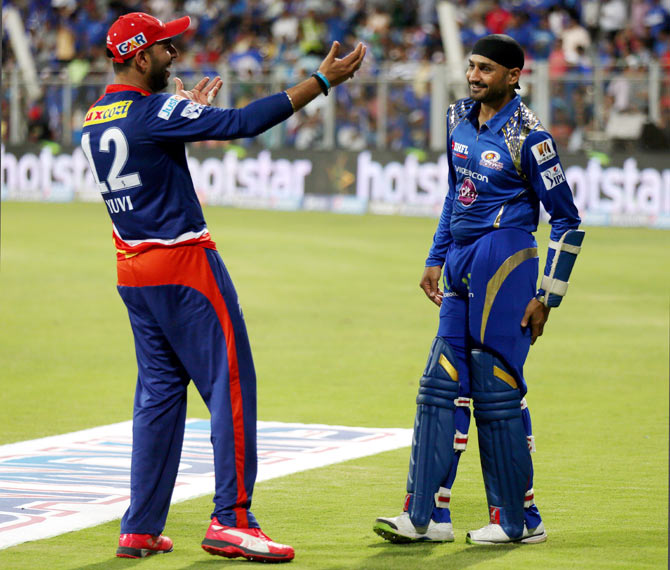 Delhi Daredevils' Yuvraj Singh greets former India teammate and Mumbai Indians' Harbhajan Singh