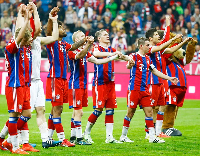 Bayern Munich players acknowledge their fans after winnin