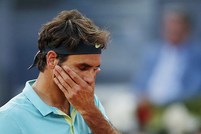 Switzerland's Roger Federer reacts during his match against Australian Nick Kyrgios in the second round of the Madrid Open tennis tournament on Wednesday