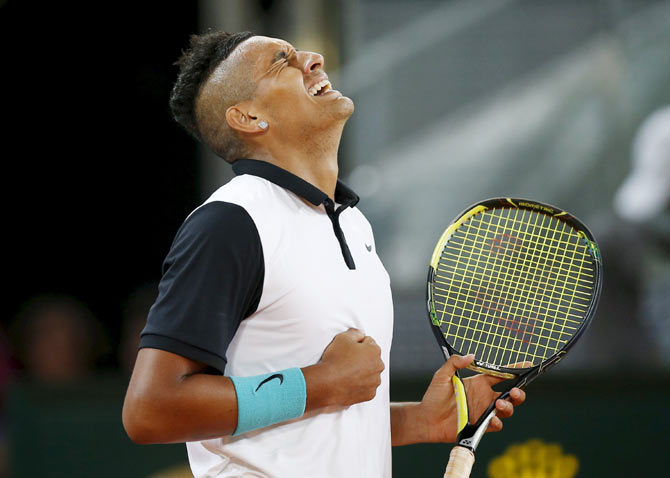 Australian Nick Kyrgios celebrates his victory over Switzerland's Roger Federer